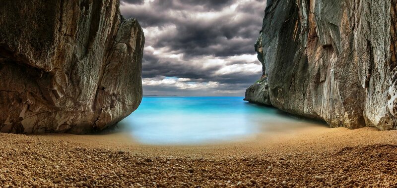 Beach Between Rock Cliffs
