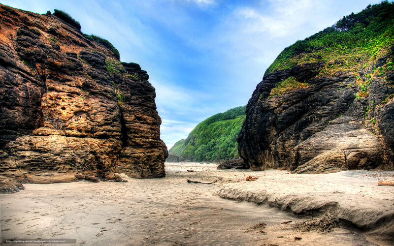 beach between rocky cliffs