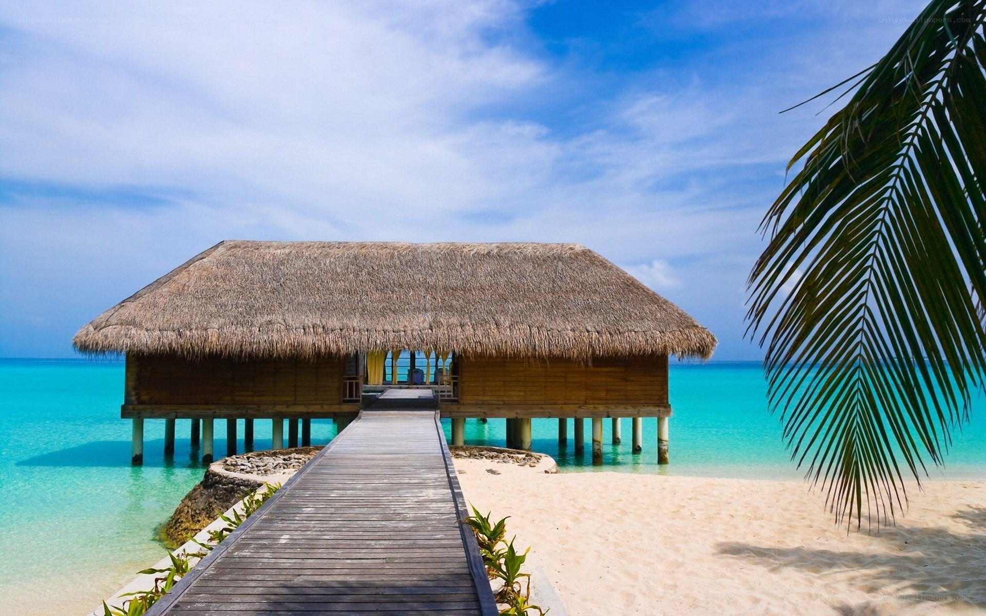 Beach bungalow with wooden walkway
