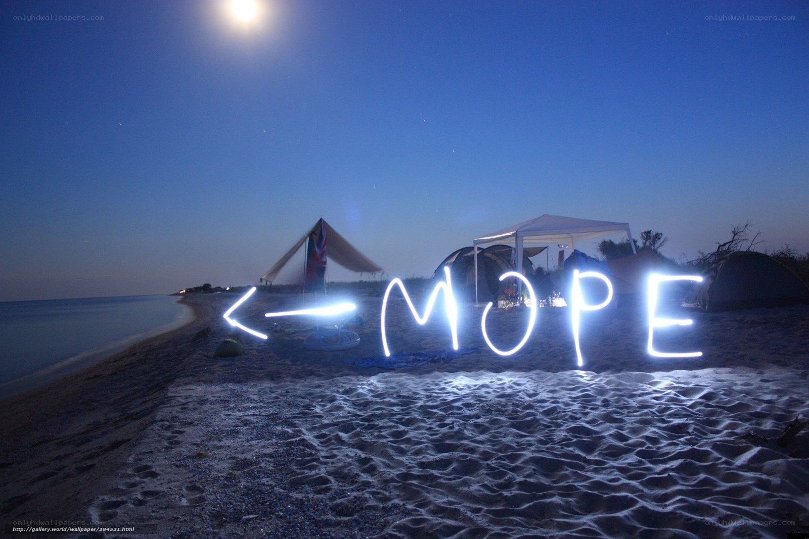 Beach camp under moonlight