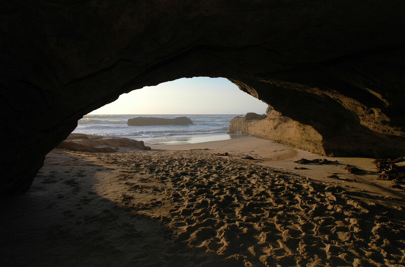 beach cave view at sunset