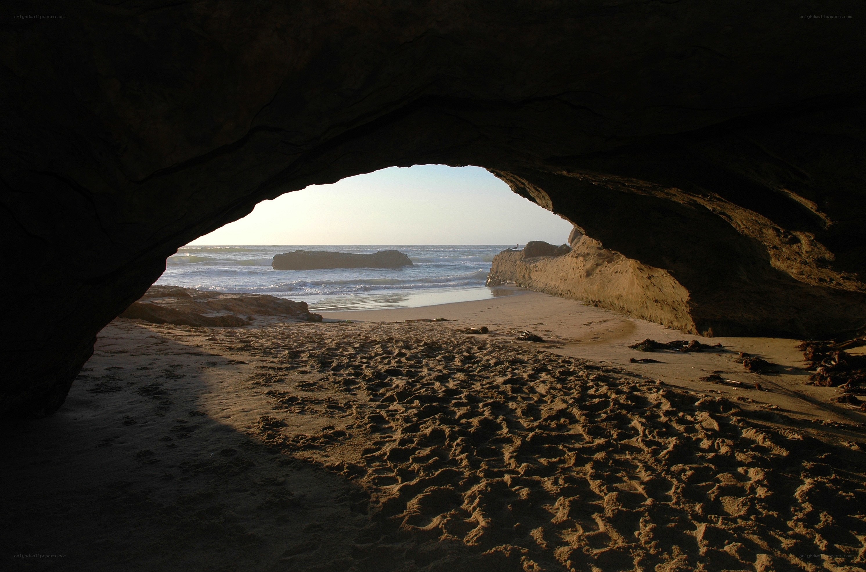 beach cave view at sunset