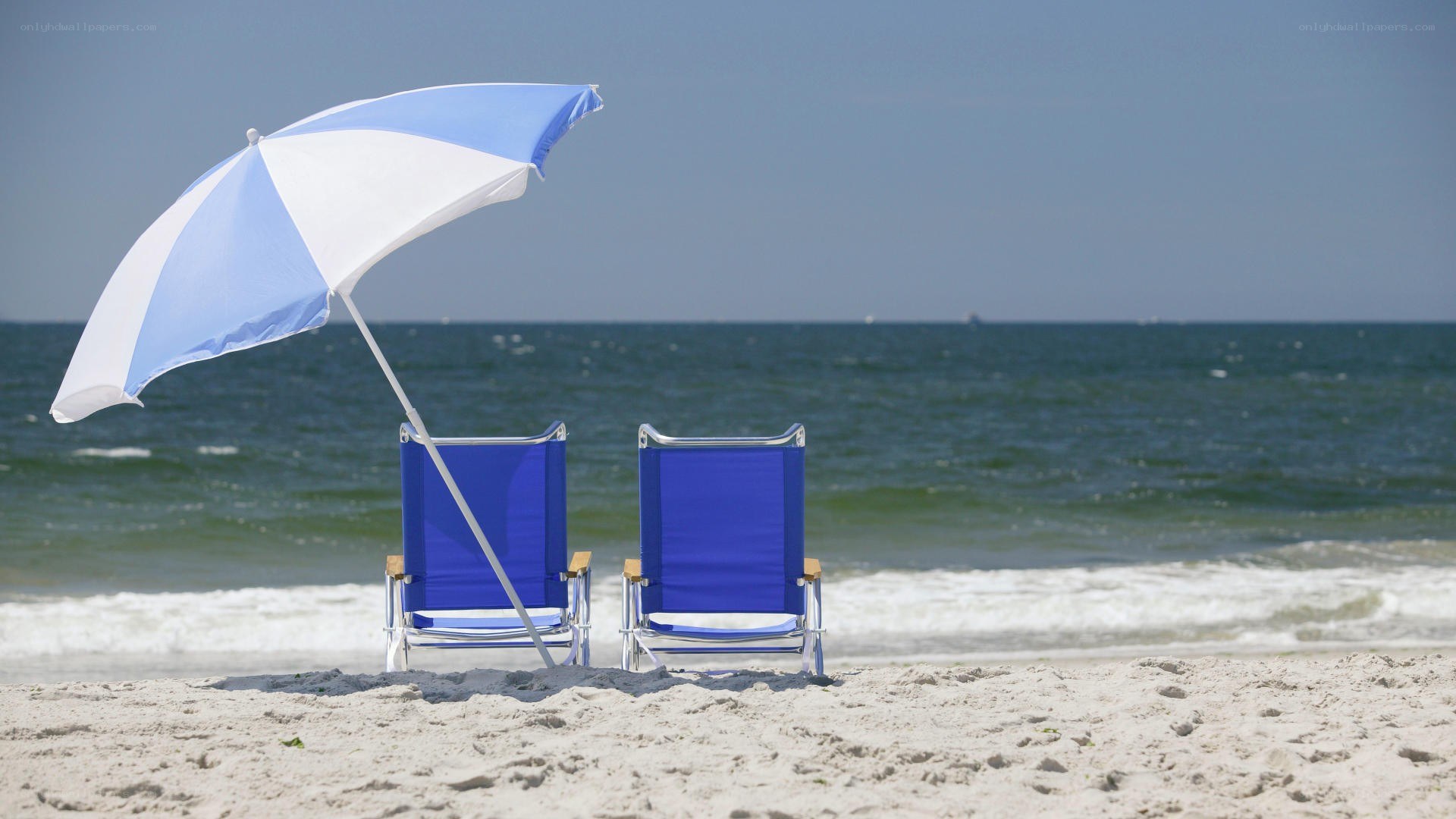 Beach chairs and umbrella