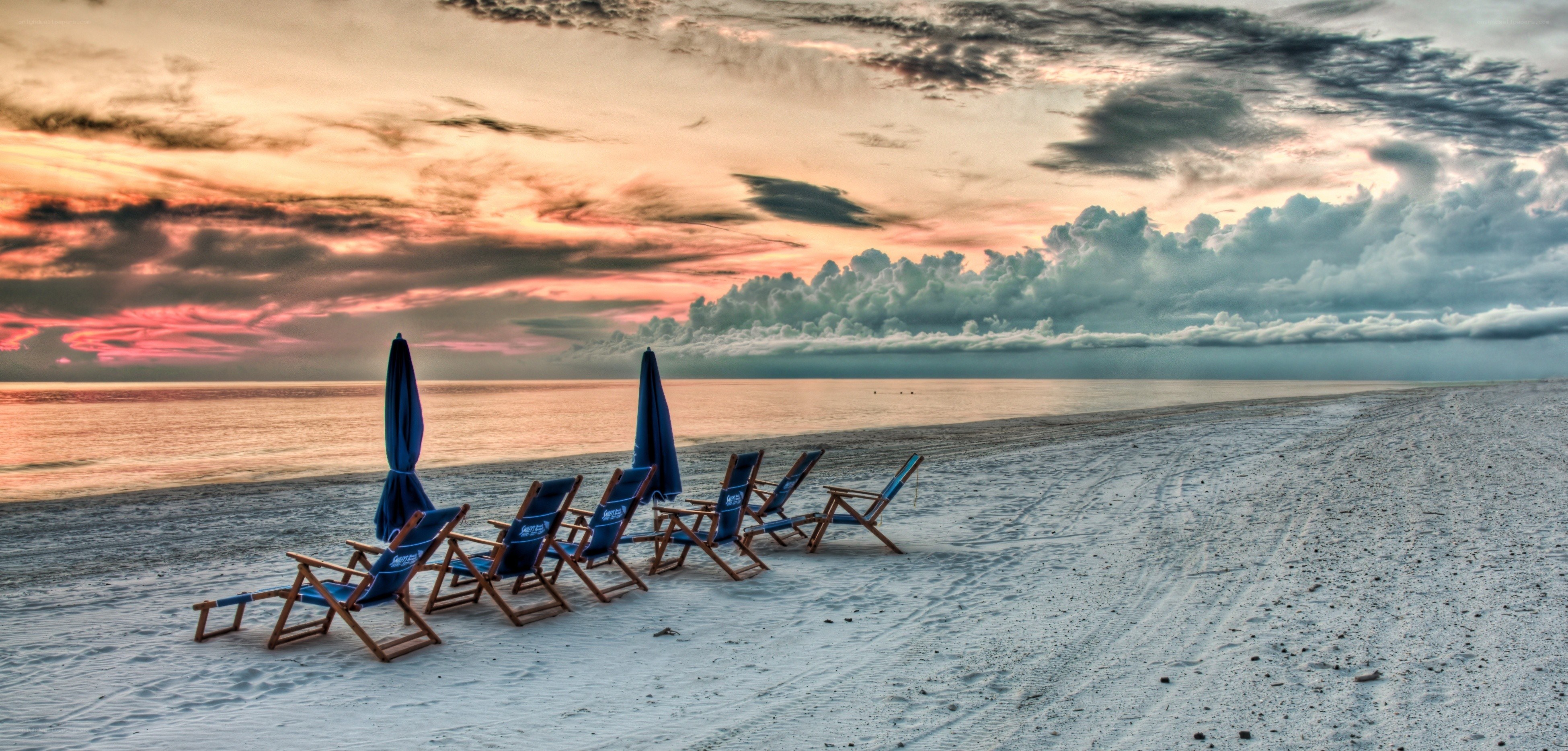 Beach chairs at sunset