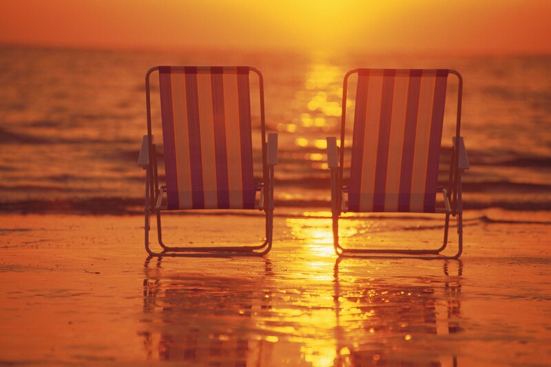 Beach chairs at sunset