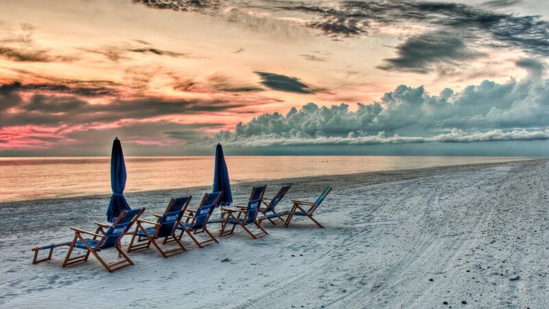 Beach chairs at sunset