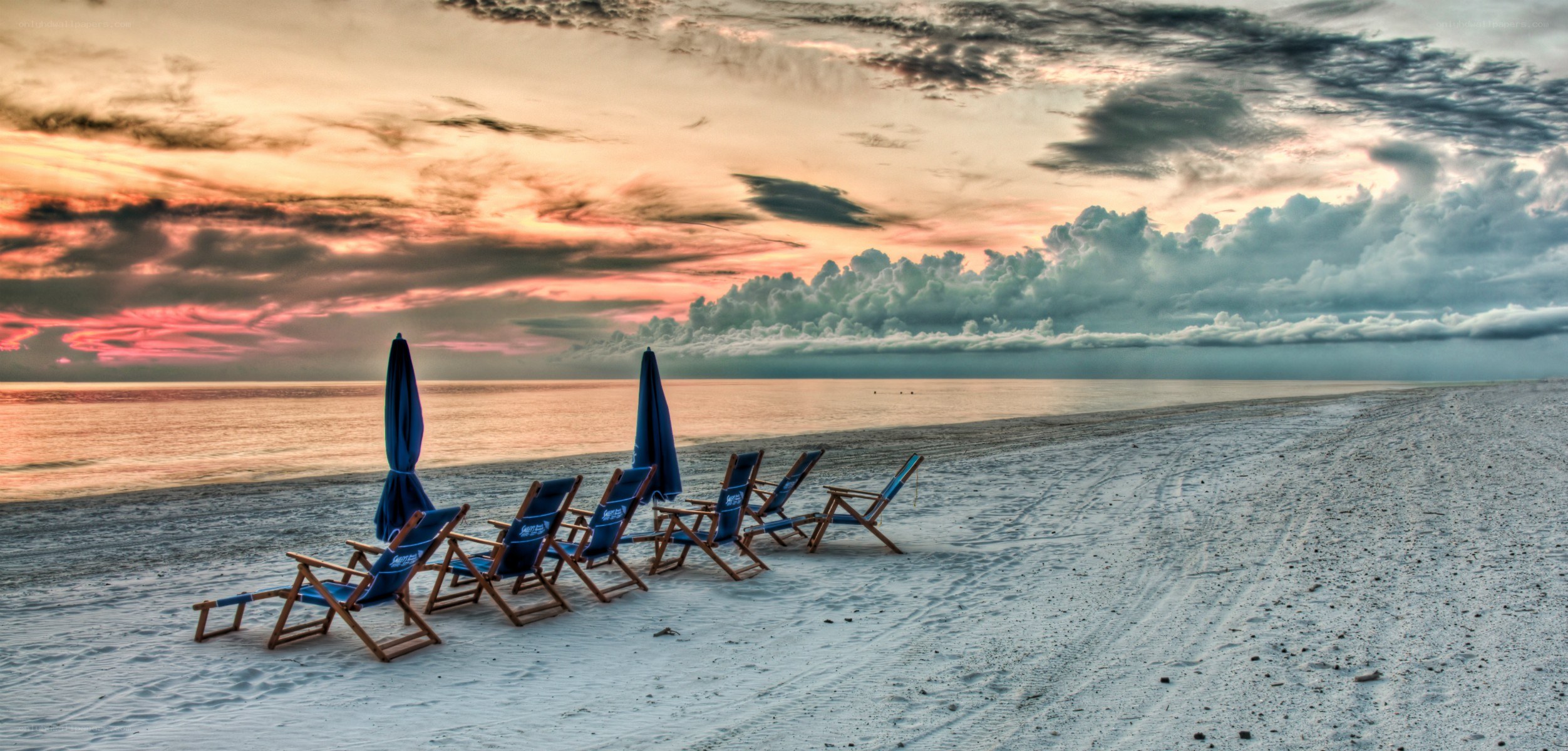Beach chairs at sunset