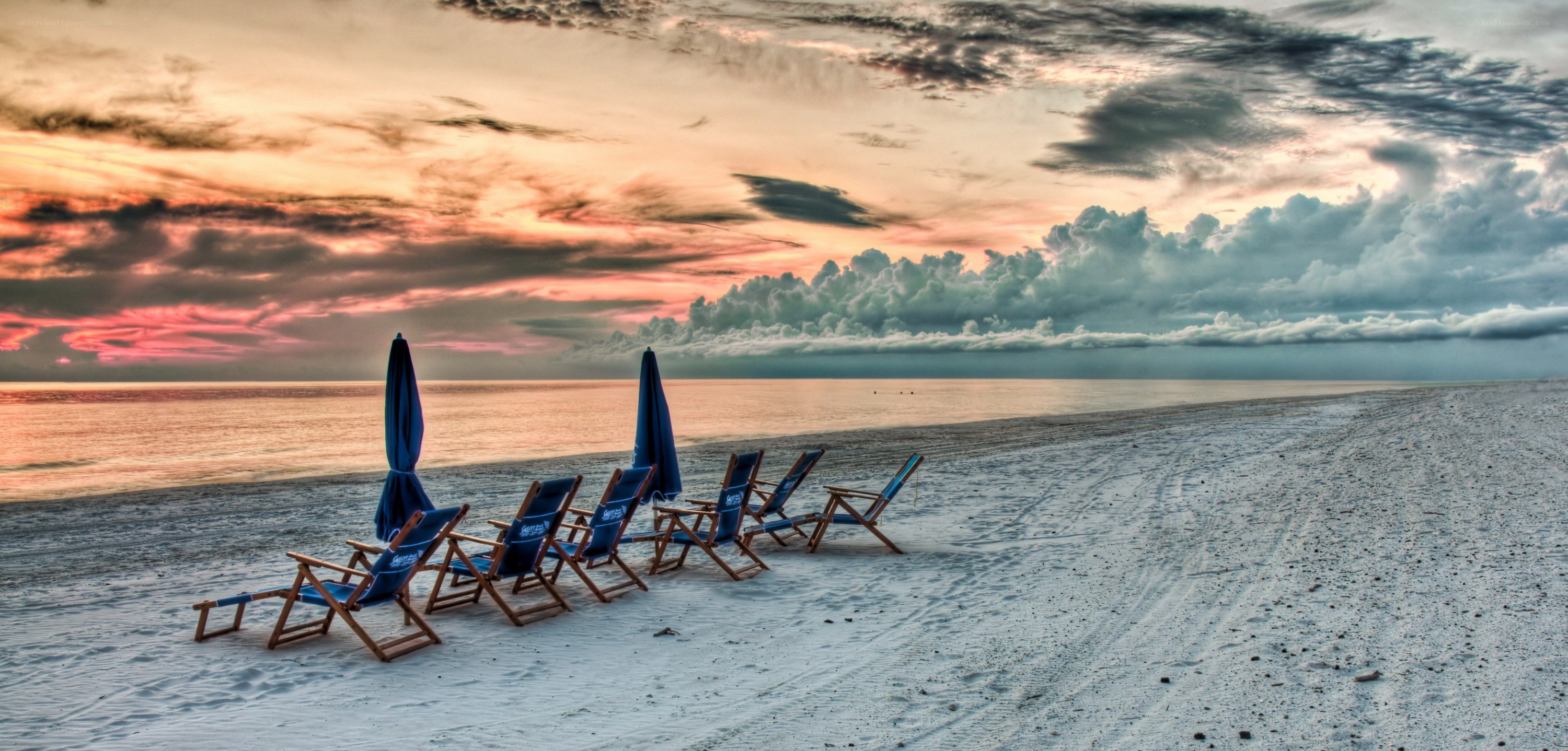 Beach chairs at sunset