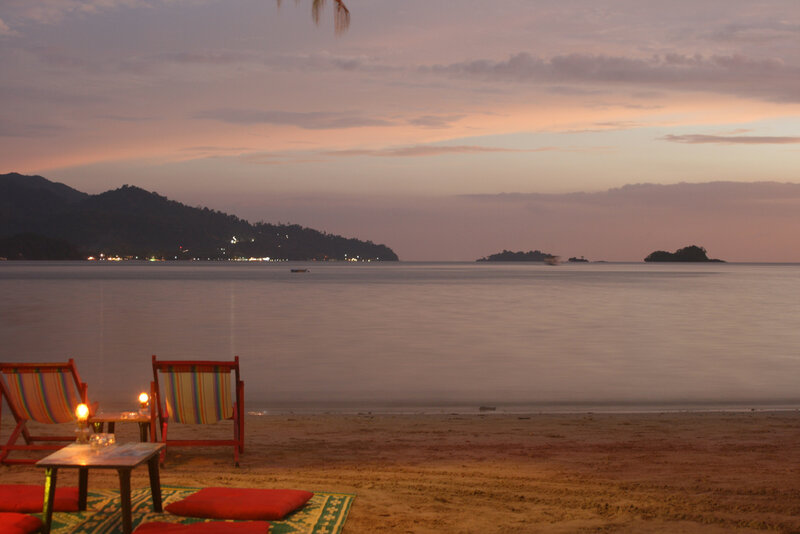 Beach Chairs at Sunset — Orange, Serene