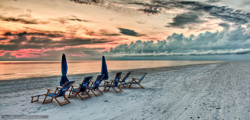 Beach chairs at sunset