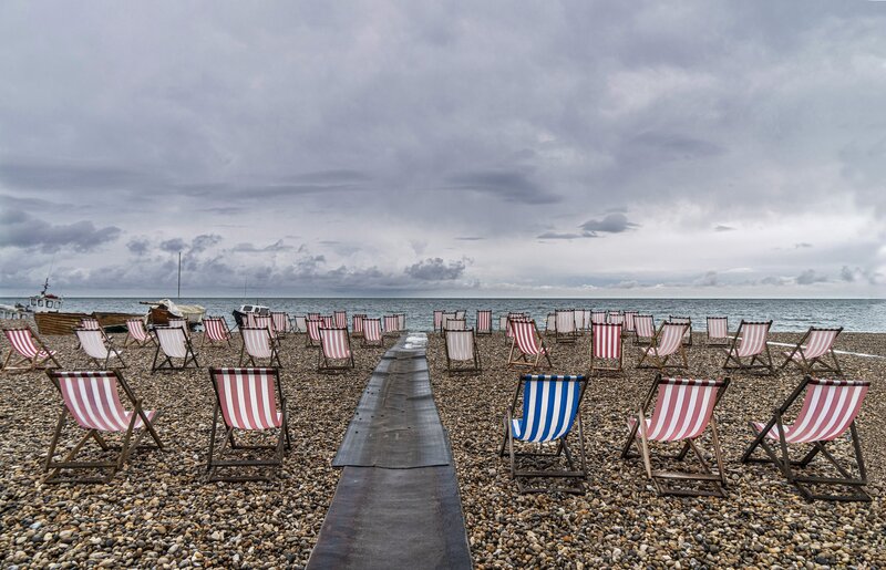 Beach Chairs on Pebble Shore — Gray
