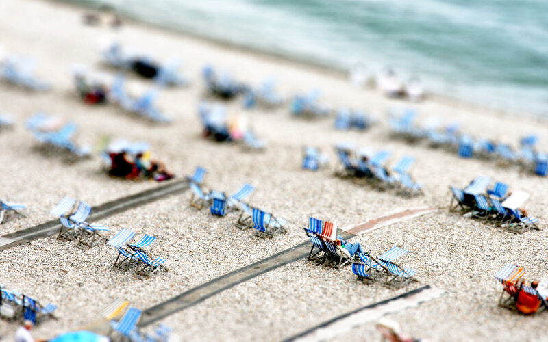 Beach chairs on pebble shore