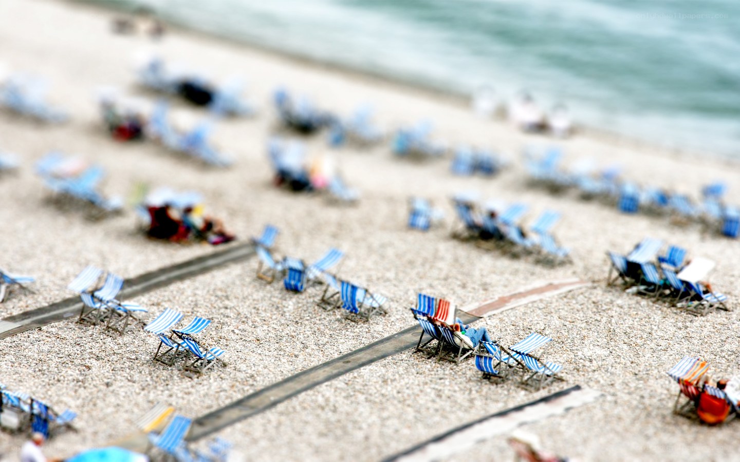 Beach chairs on pebble shore