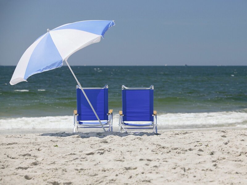 Beach chairs under umbrella