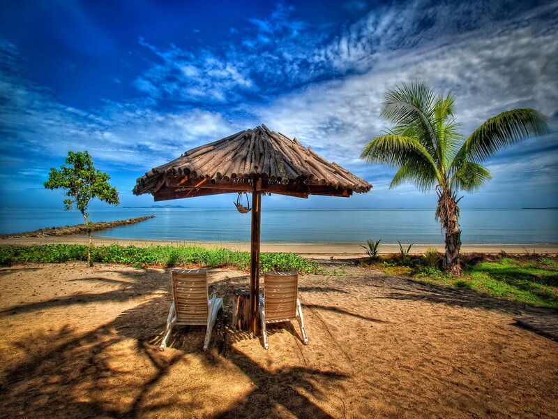 Beach Chairs under Umbrella — Blue, Serene, Afternoon, Photograph, Palm Tree, Ocean