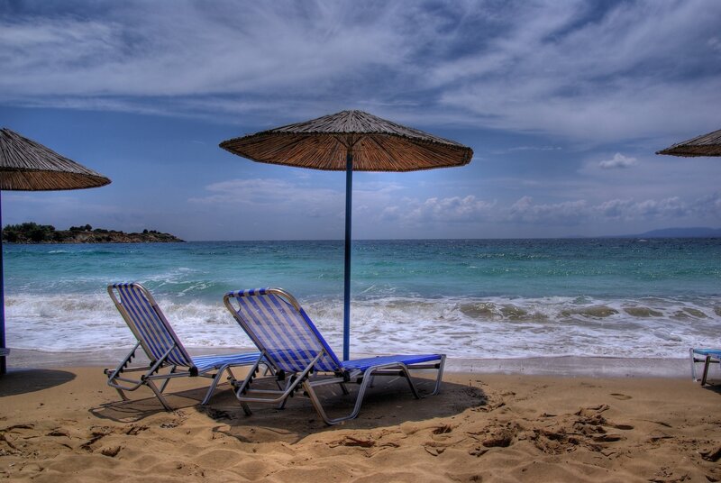 Beach chairs under umbrellas
