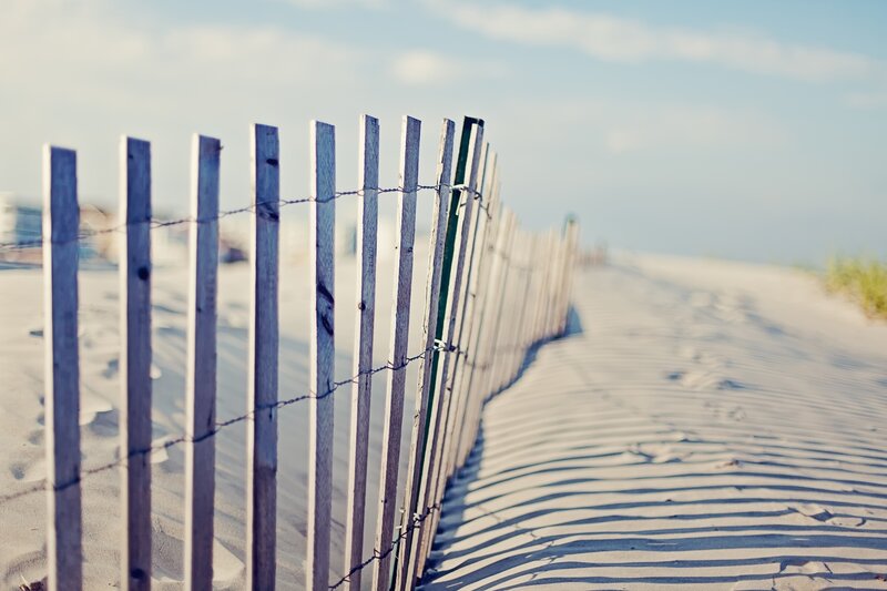beach fence on sandy dune