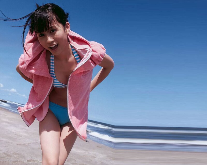 beach girl in pink towel