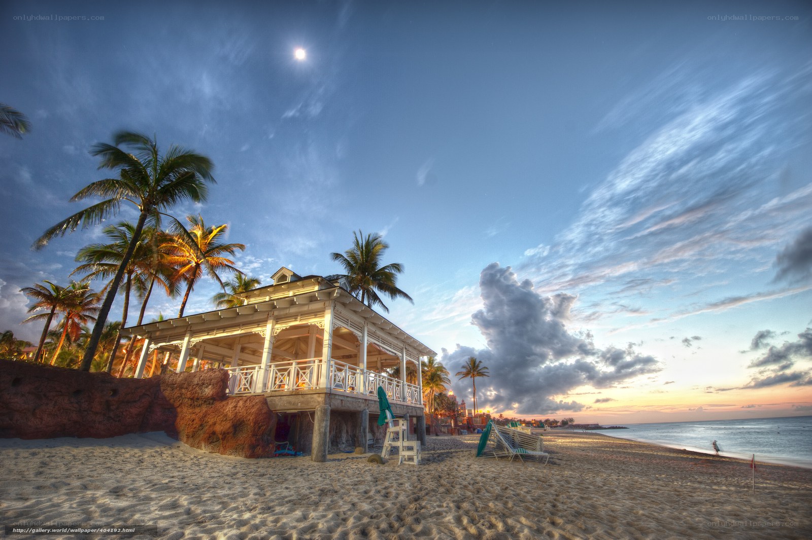 Beach house at sunset with moon