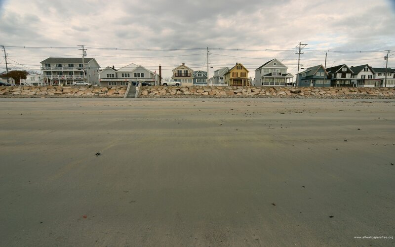 beach houses under cloudy sky
