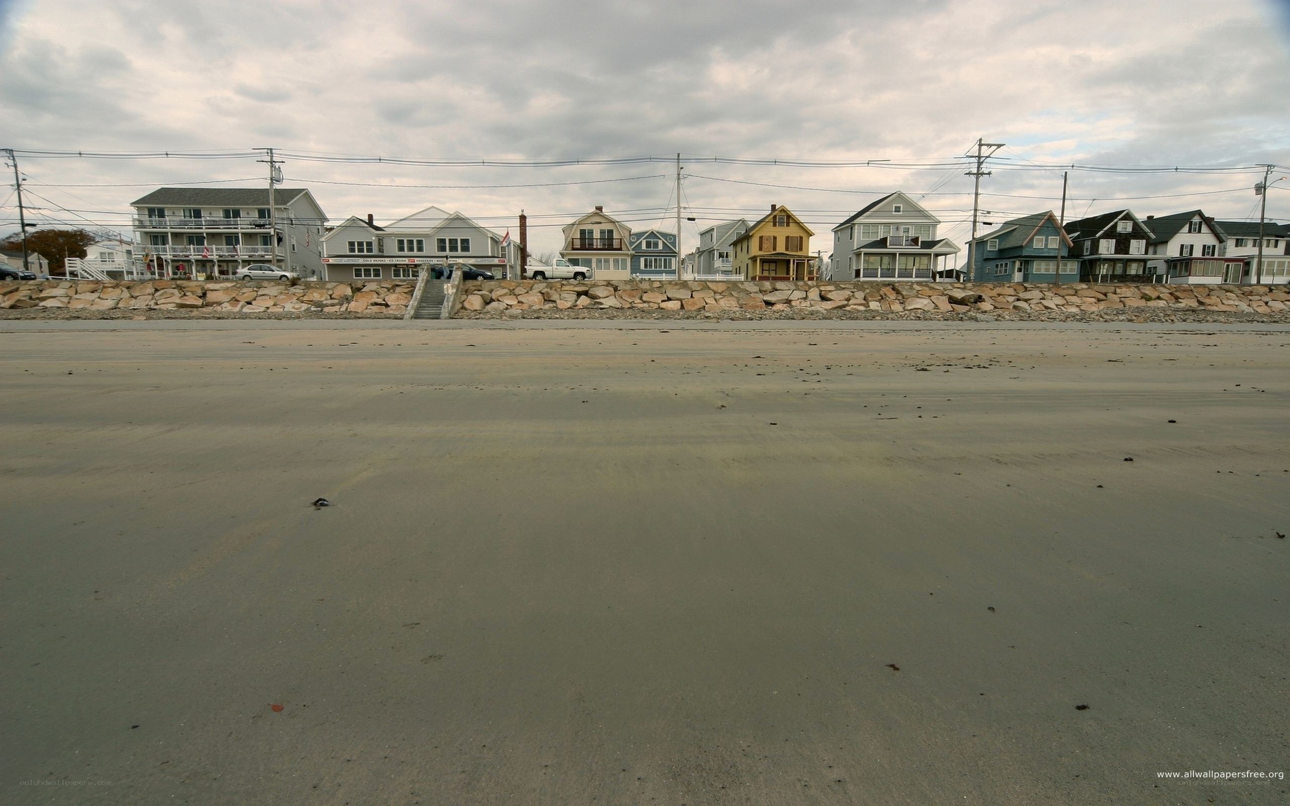 beach houses under cloudy sky