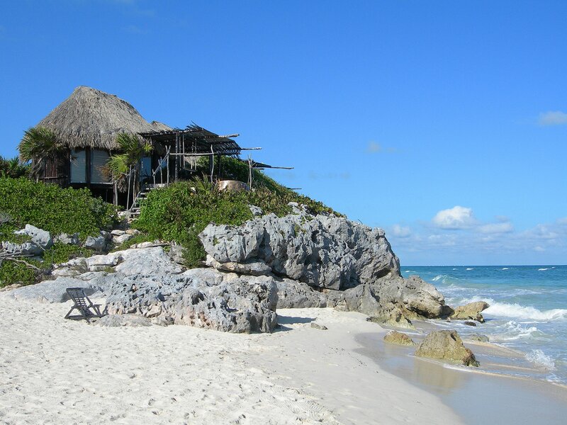 Beach hut on rocky cliff