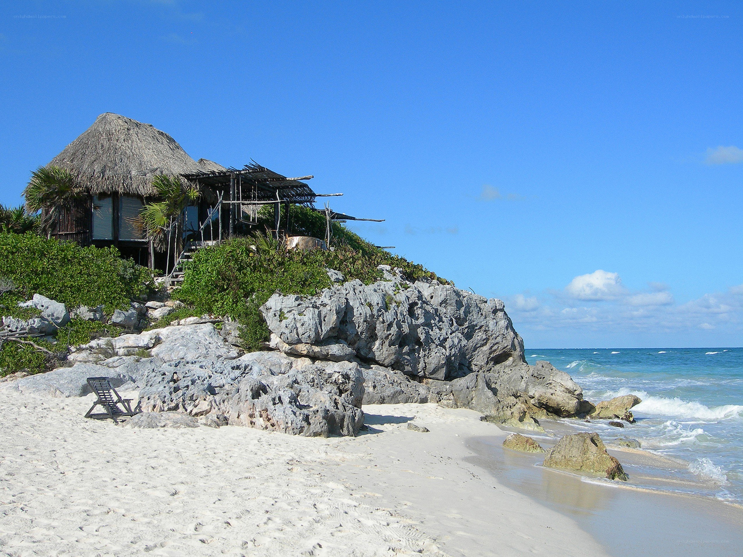 Beach hut on rocky cliff