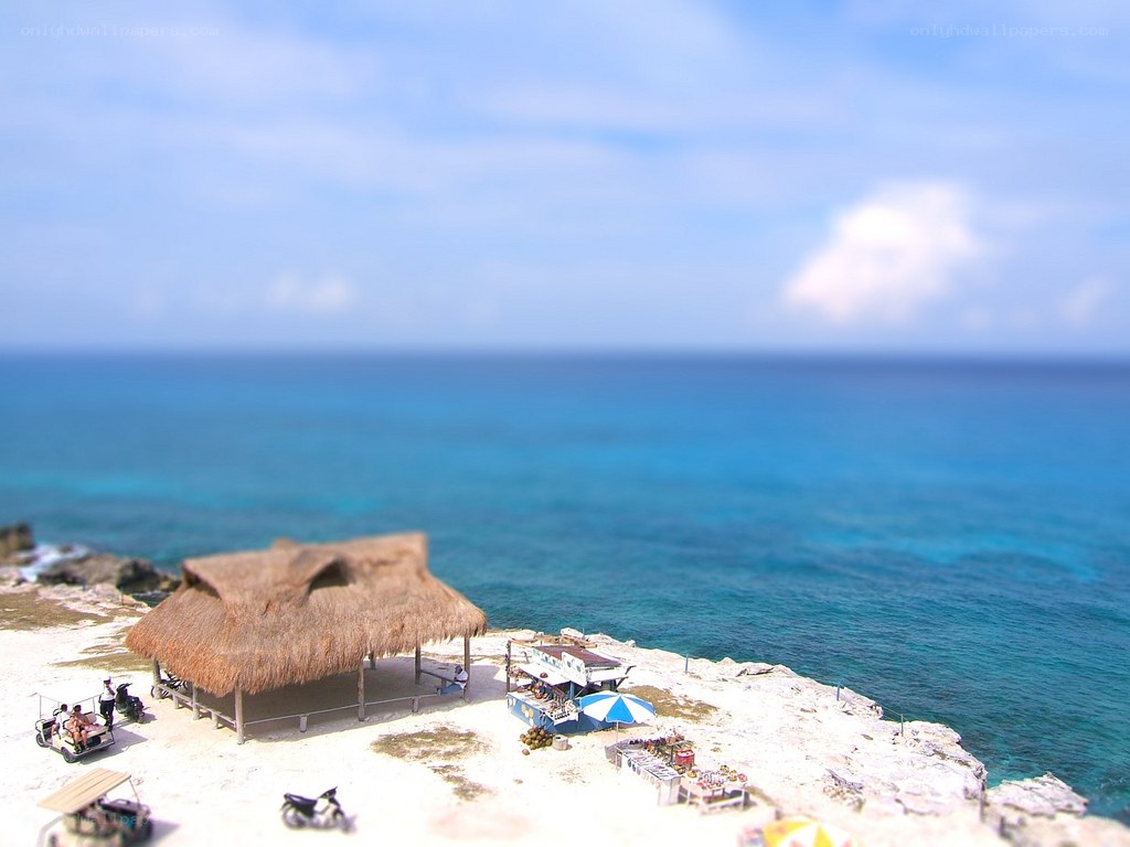 Beach hut on rocky cliff