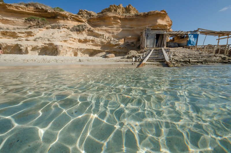 Beach Hut on Rocky Shore
