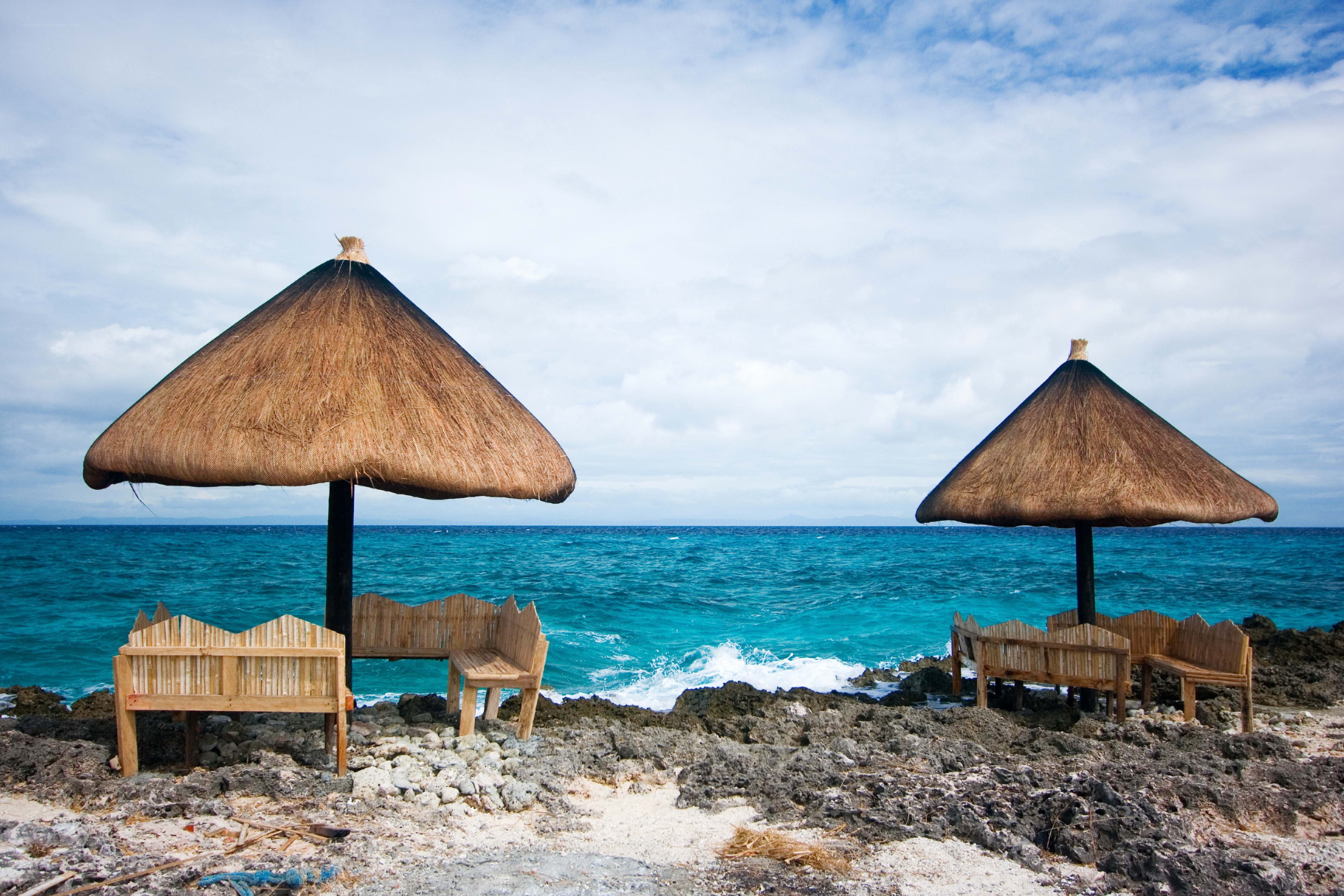 Beach huts on rocky shore
