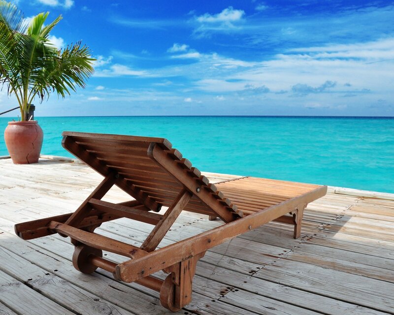 Beach lounge chair by the ocean
