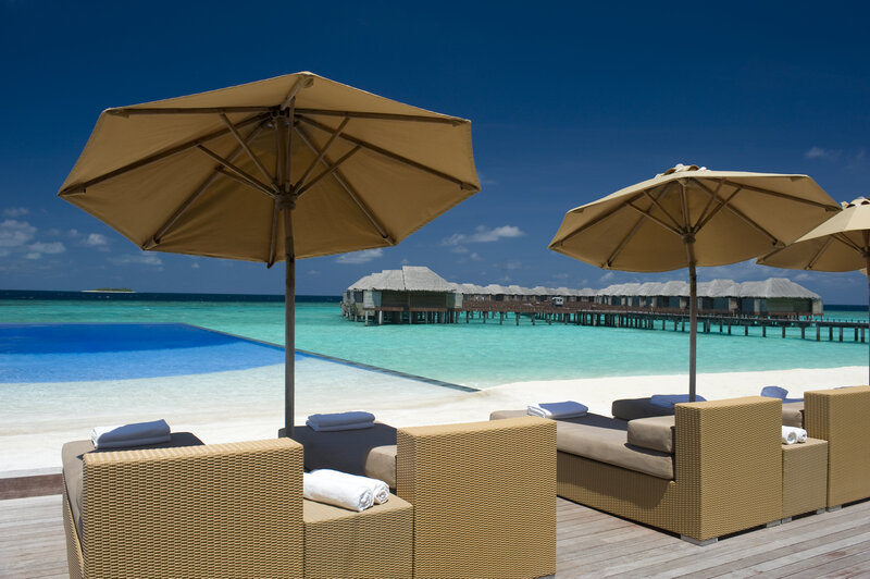 Beach Lounge Chairs — Blue, Serene, Afternoon, Photograph, Umbrellas