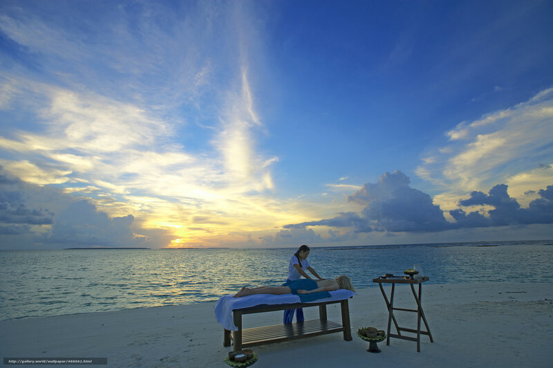 Beach massage at sunset