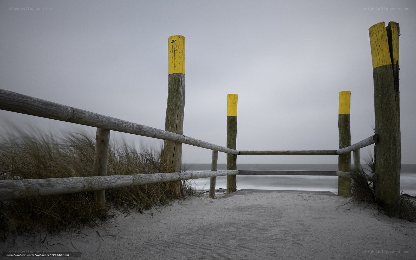 Beach path with wooden fence