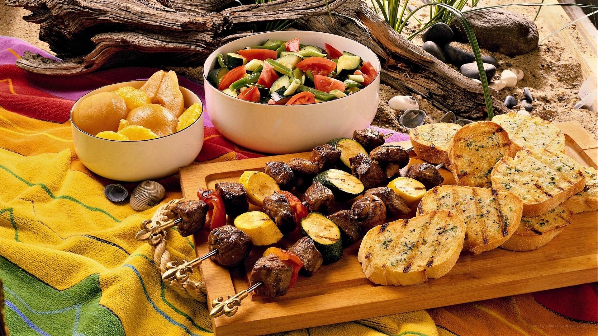 Beach picnic with skewers and salad
