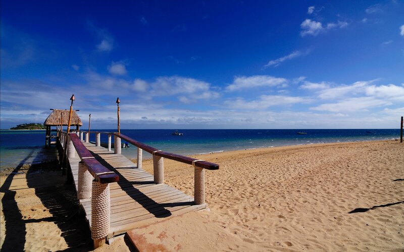 Beach pier with thatched hut