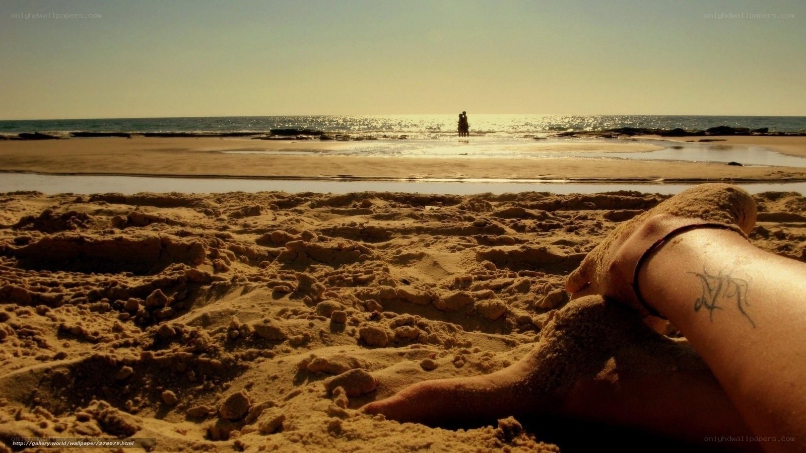 Beach relaxation with tattoo