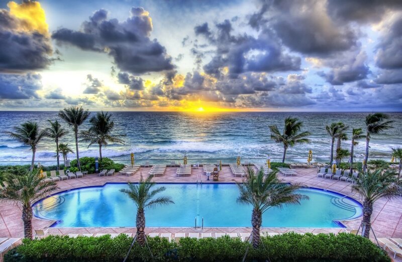 Beach resort pool at sunset