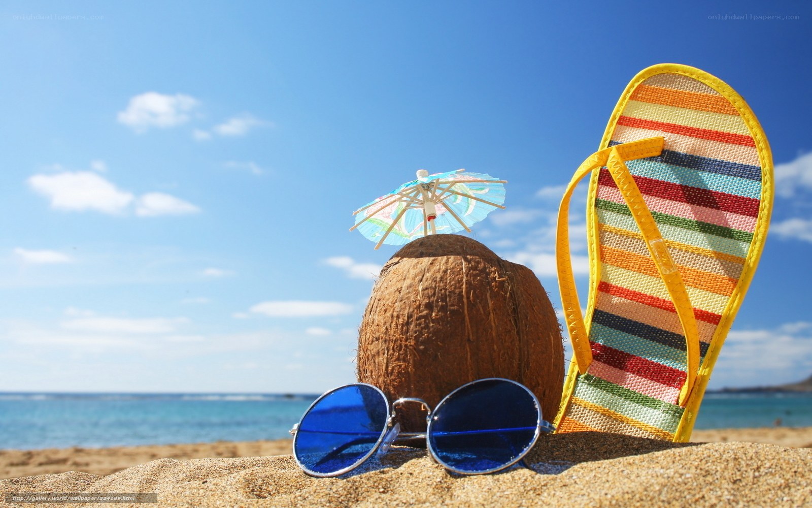Beach scene with coconut and flip-flops