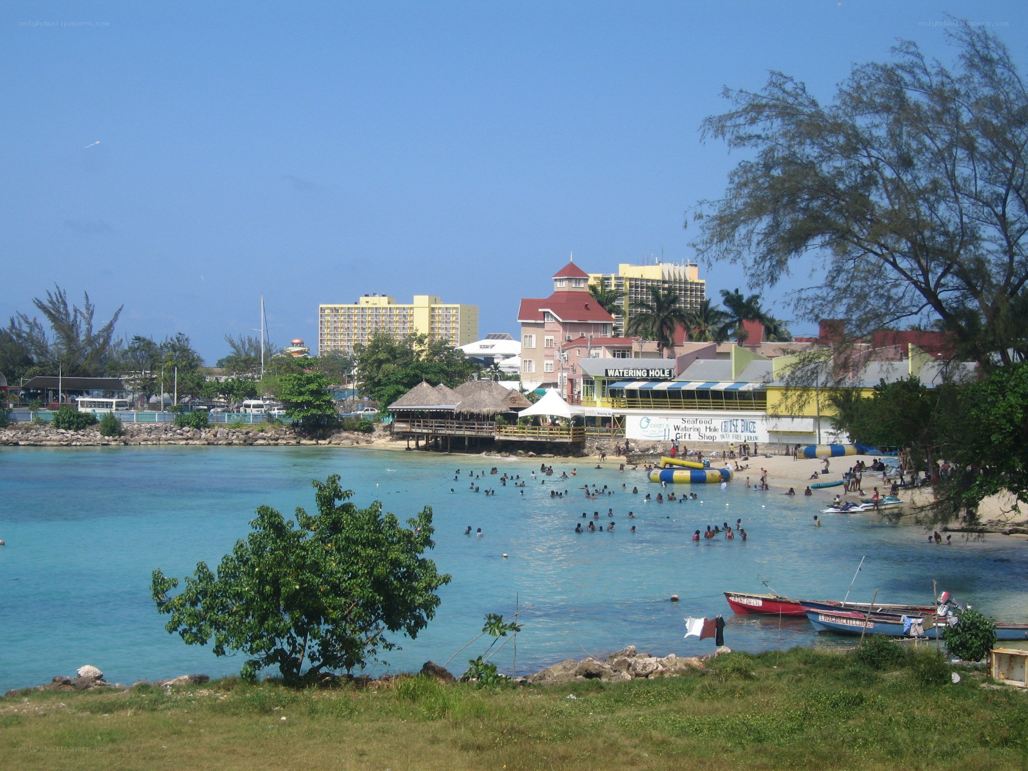 beach scene with resort buildings