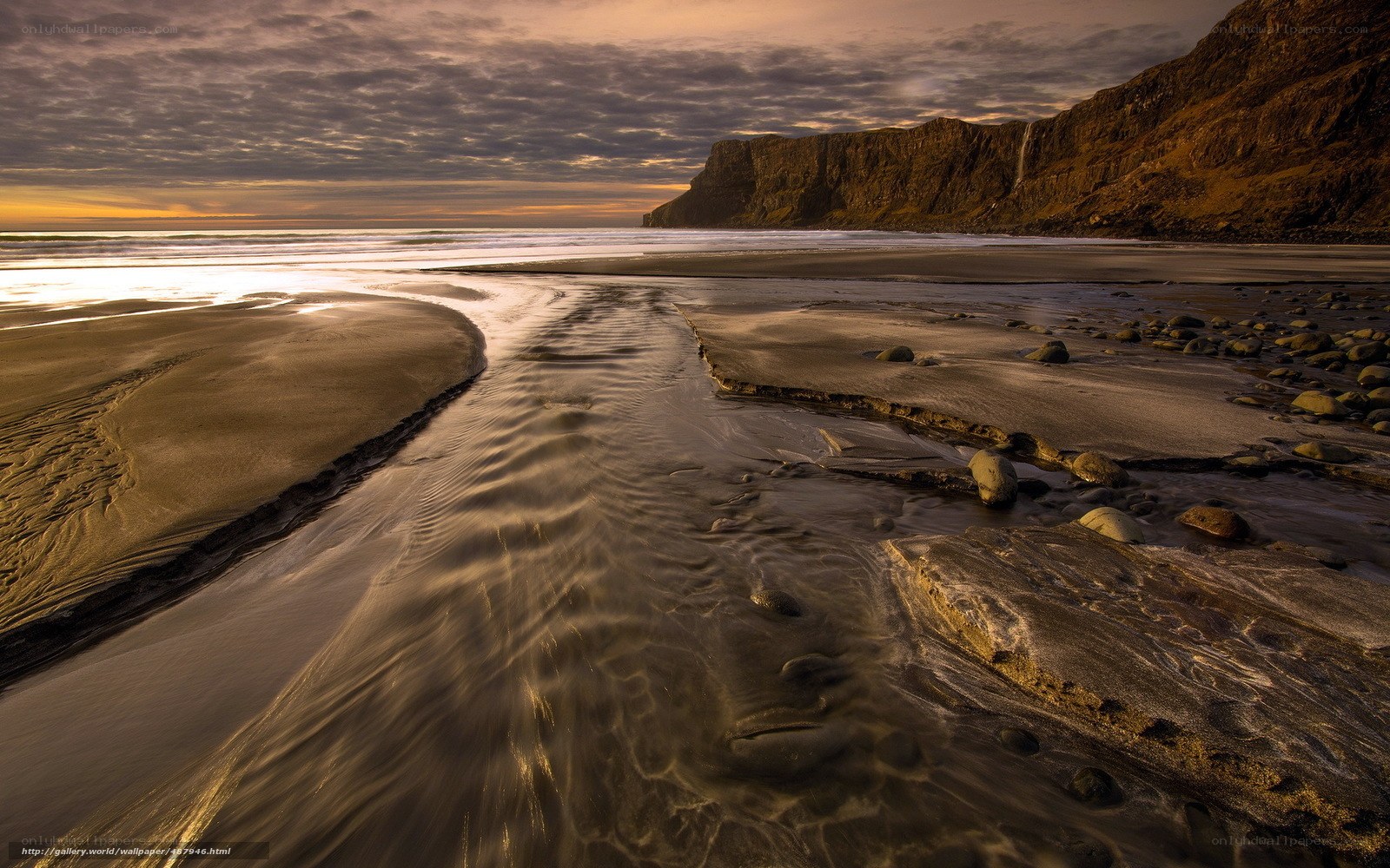 Beach stream at sunset