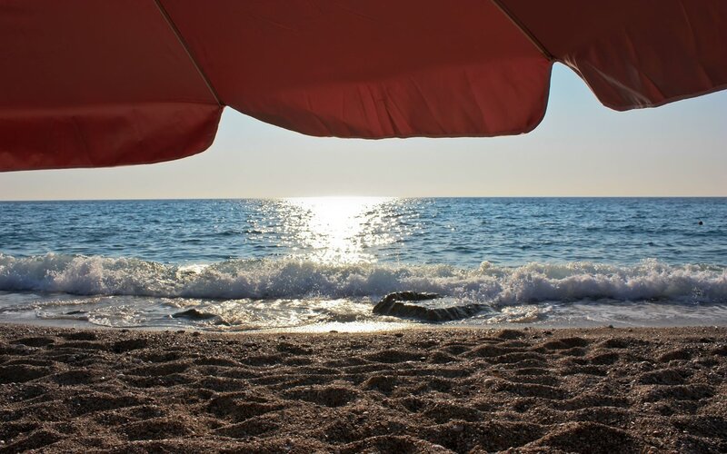 beach sunset under umbrella