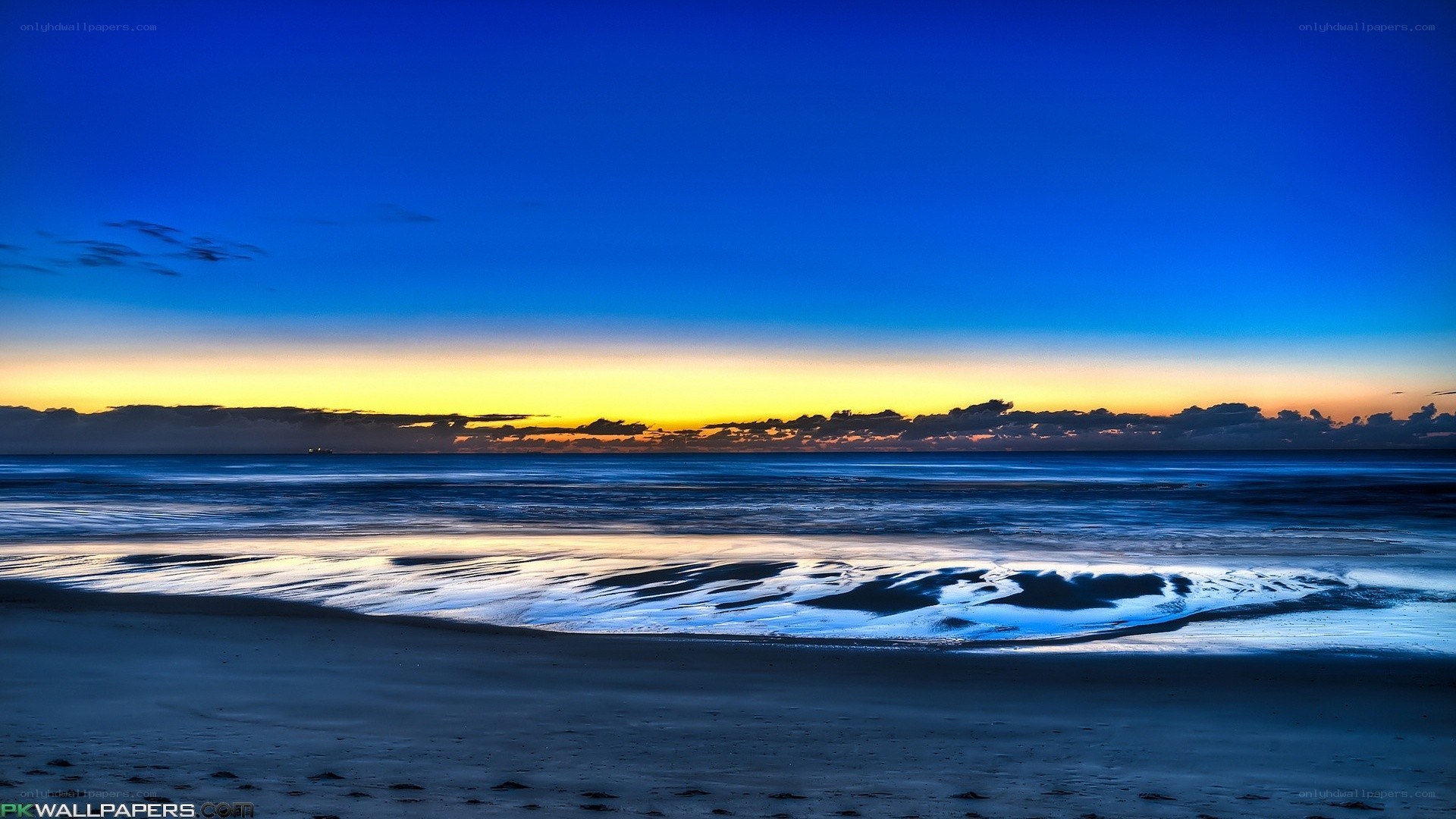 Beach sunset with golden sky