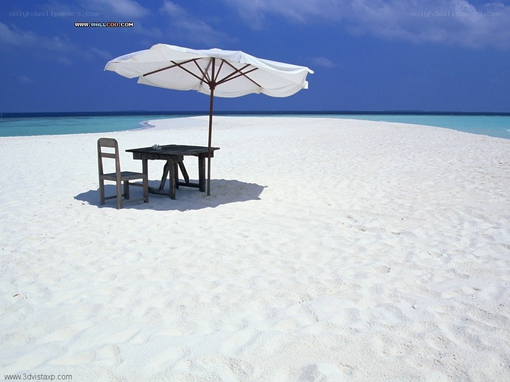 Beach table under umbrella