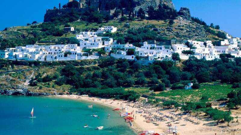 Beach town with castle on hill