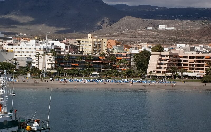 beach town with mountains