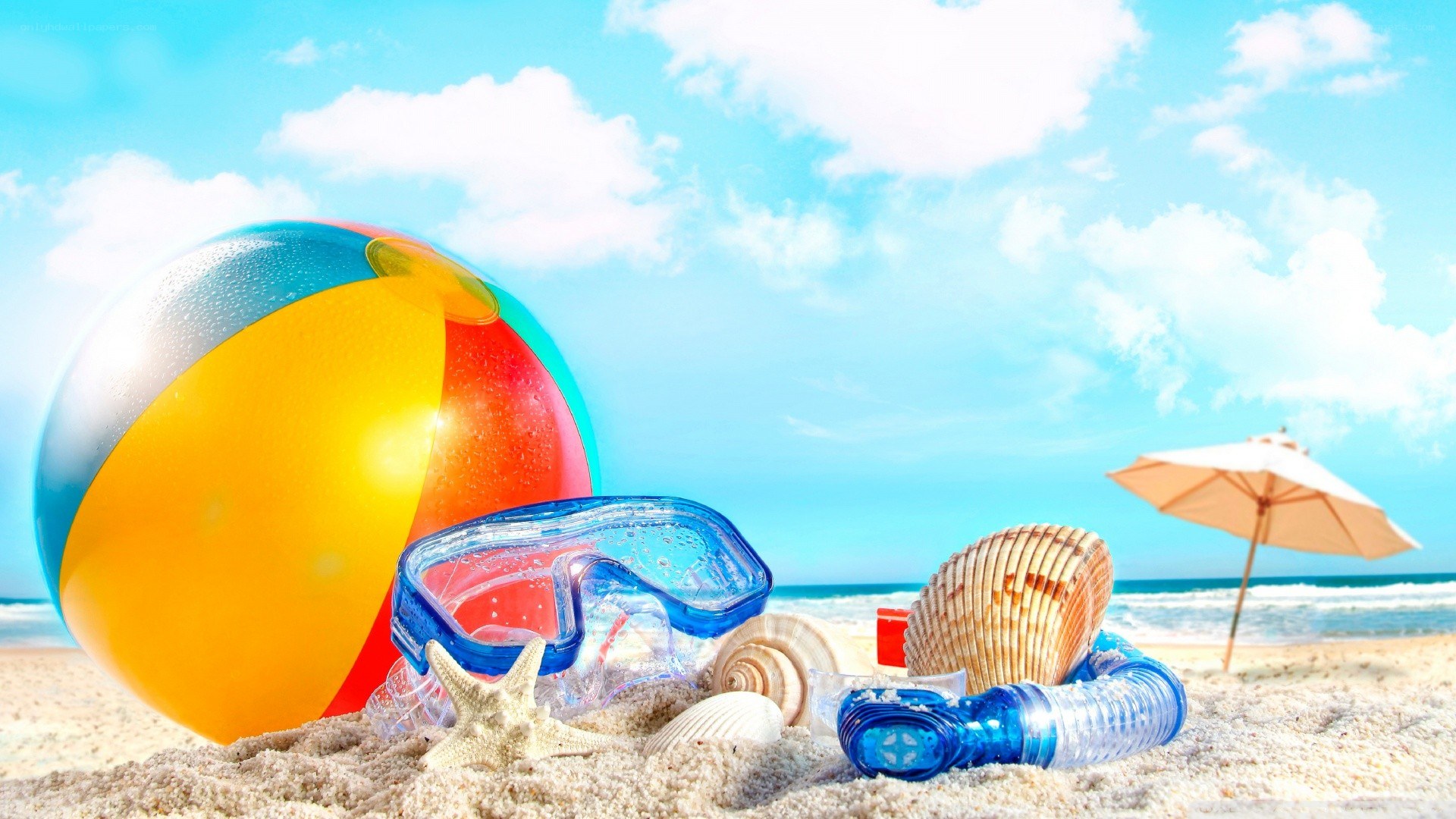 Beach toys on sandy shore