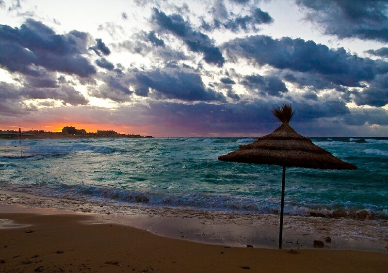 Beach umbrella at sunset