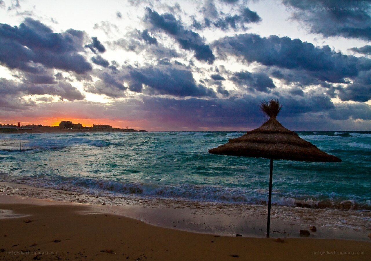 Beach umbrella at sunset