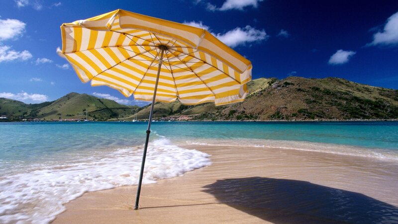 Beach umbrella on tropical shore